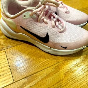 Lightly worn light Pink size 1Y Nike lace up sneakers.